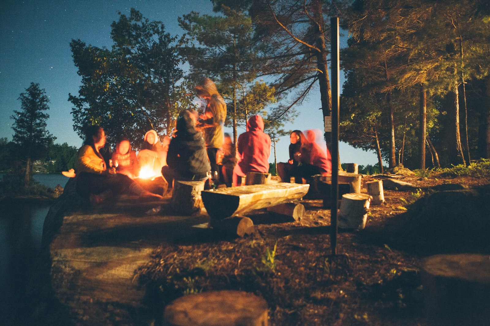 Firelit tent at night in a mountain campsite